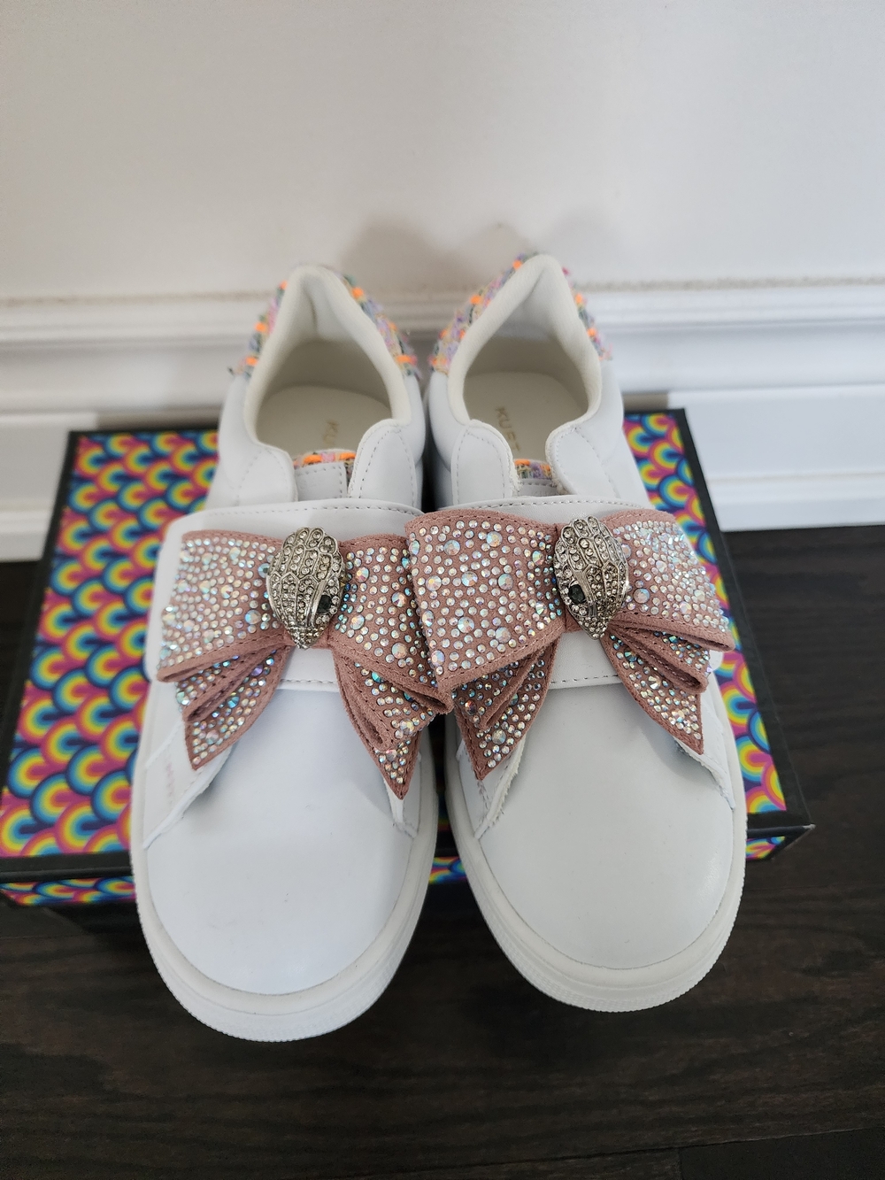 Kurt Geiger White Slip-On Sneakers with Blush Crystal Bow and Snake Head Details